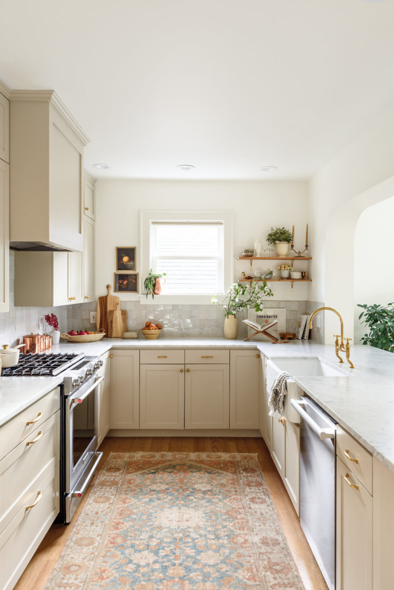 Beige Cabinets + Brass Hardware Bringing Charm To A Traditional Kitchen
